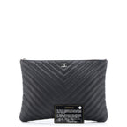O Case Clutch Chevron Caviar Medium